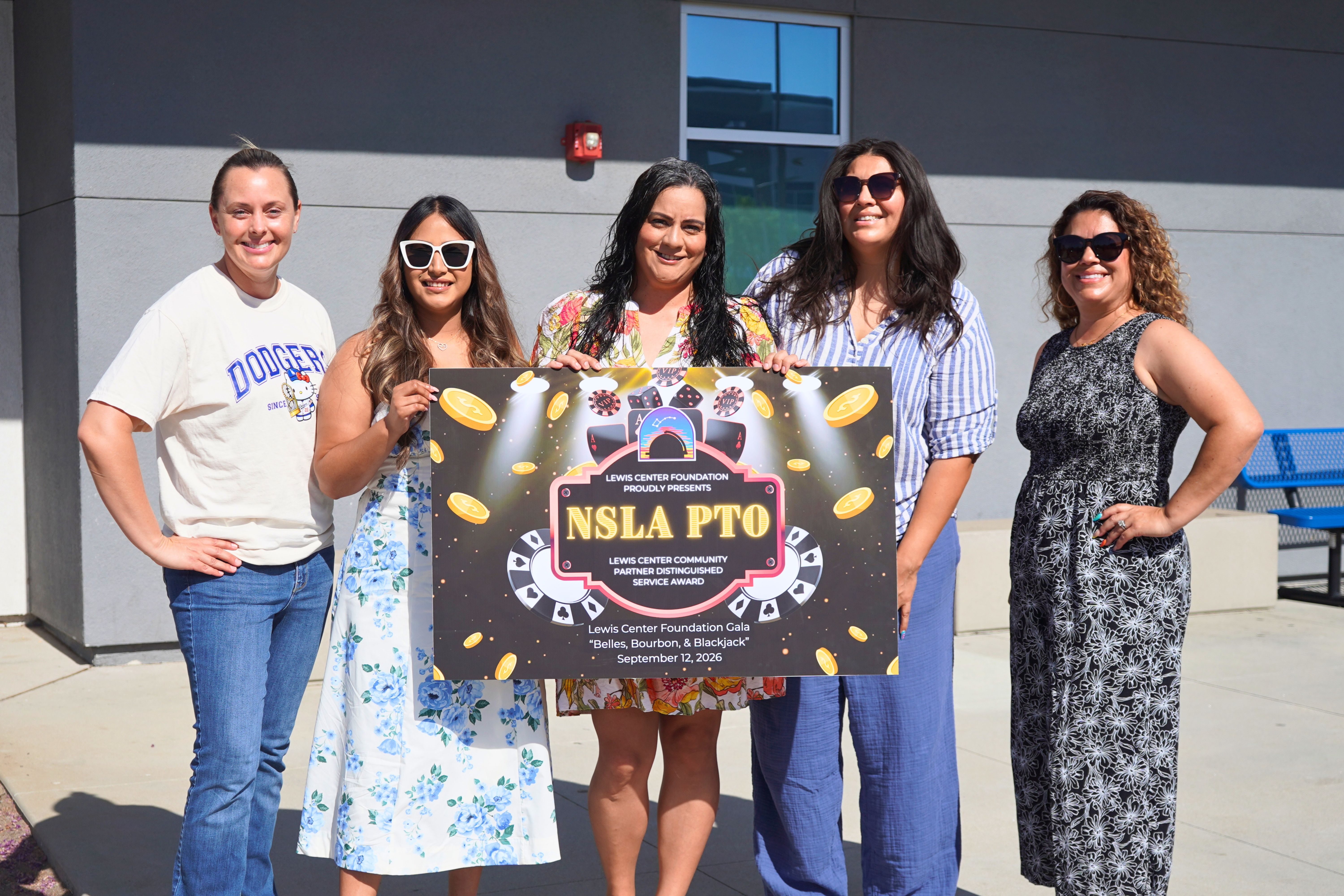 photo of NSLA PTO holding 2026 Lewis Center Foundation Gala sign.
